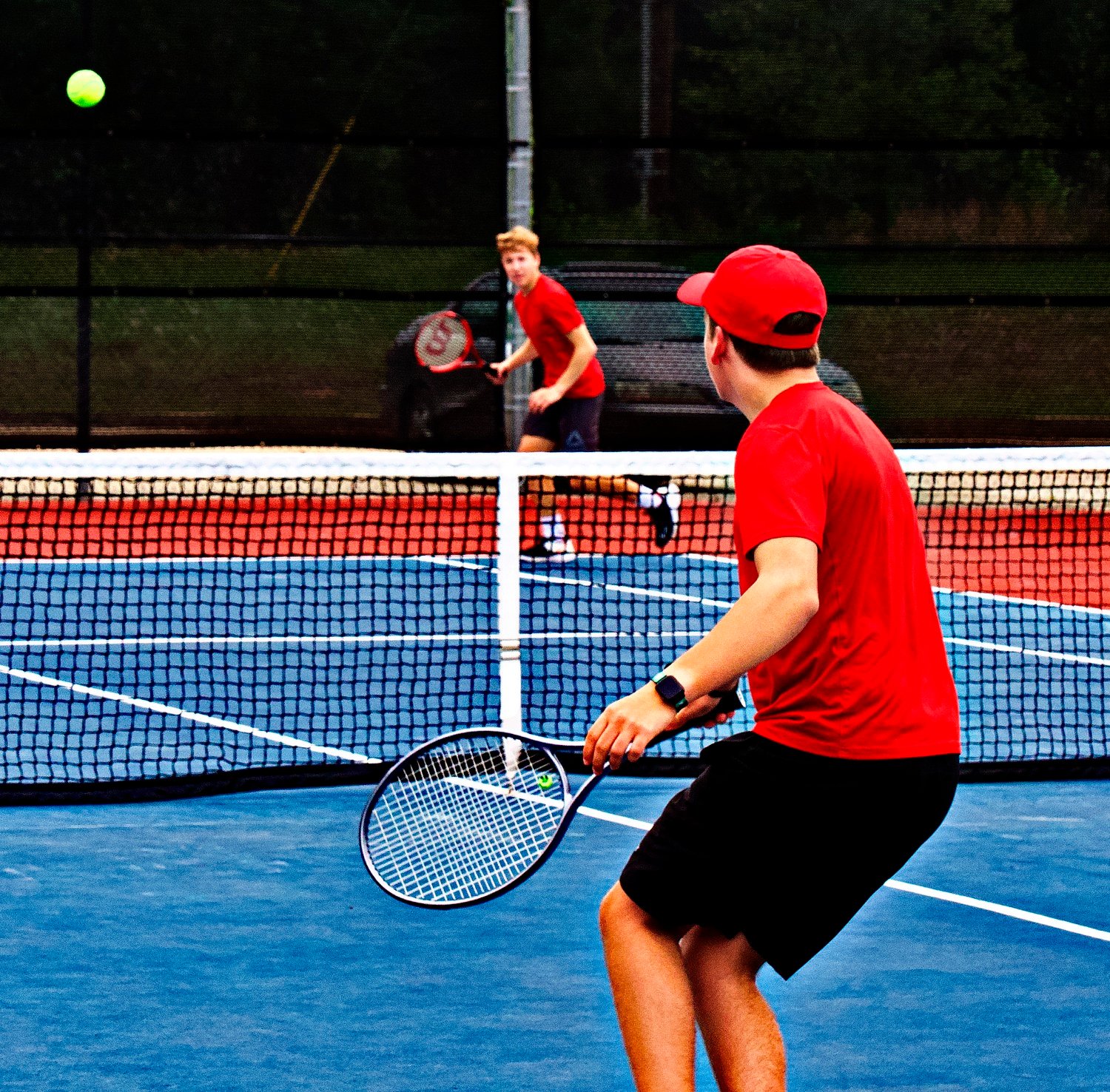 Will Hartin (background, left) and Cameron Gallyean face off for the district title. [see more shots]